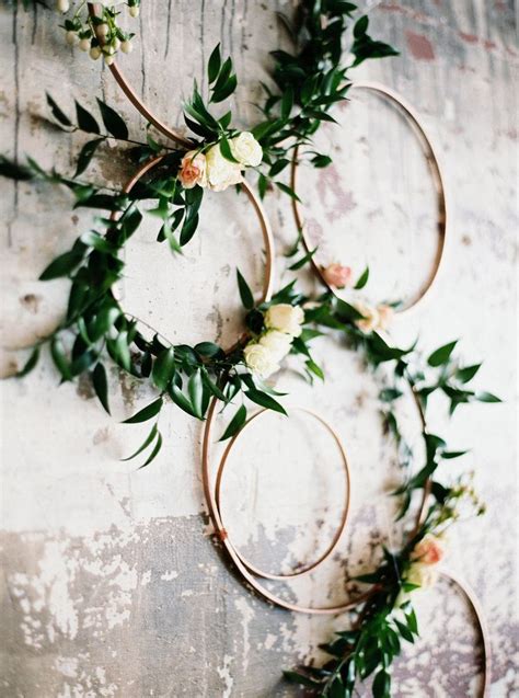 floral hoop wedding ceremony altar arrangement made from cross stitch hoops italian ruscus