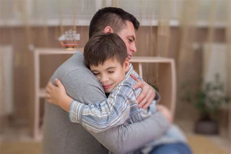 Sad Son Hugging His Dad Indoor Stock Photo Image Of Anxiety Lonely