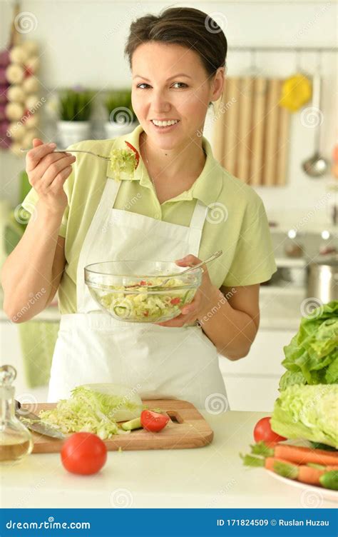 Beautiful Young Woman Making Salad In Kitchen Stock Image Image Of