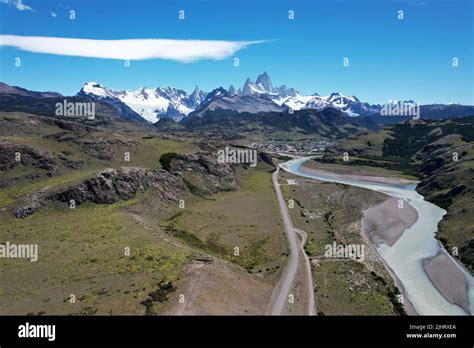 An Aerial View Of Fitz Roy Mountain With Blue Sky And River Patagonia