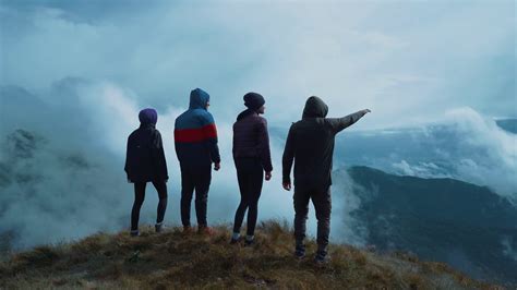 The Four People Standing On A Picturesque Mountain Stock Video Footage