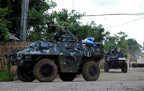 Armoured Personnel Carriers Apc Ride Along The Main Street As