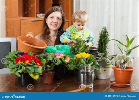 Mother And Baby With Flowering Plants Stock Photo Image Of Florist