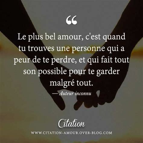 Two Hands Holding Each Other With The Words Love In French Above Them And An Image Of