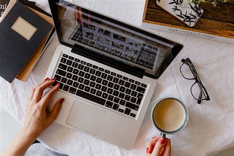 Hd Wallpaper A Woman Works At A Desk With A Laptop And A Cup Of Coffee