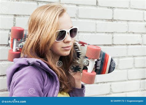Blond Teenage Girl In Sunglasses With A Skateboard Stock Image Image