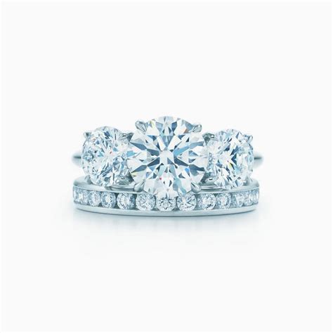 Leave her speechless with a three stone engagement ring representing your past, present and future. Tiffany Three Stone engagement ring in platinum: an expression of eternal love. | Tiffany & Co.