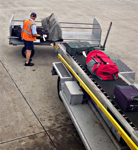 Loading Luggage Onto Plane Stock Image Image Of Transportation 2435797