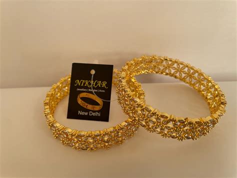 Gold Floral Bangles Nikhar Jewellery