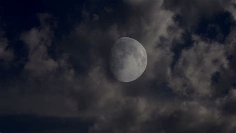Dark Night Sky With A Full Moon Shining Bright As Clouds