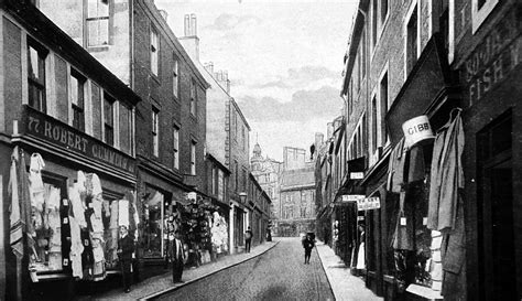 It's a market and former county town straddling the river nith: Tour Scotland: Old Photograph Friars Vennel Dumfries Scotland