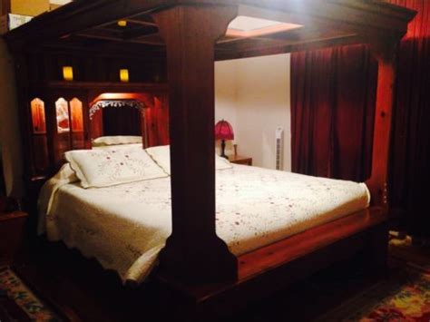 It reflects light from the window that is on the wall directly across the room. Solid-wood-king-canopy-bed-with-mirrored-ceiling-AND ...