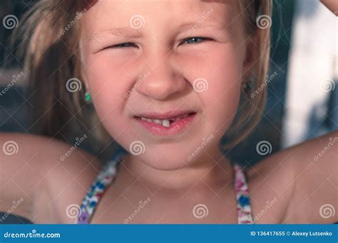 Portrait of a Little Girl with a Wobbly Baby Tooth Stock Image - Image