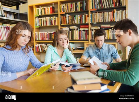 Students Reading Books In Library Stock Photo Alamy