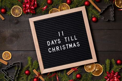 11 Days Till Christmas Countdown Letter Board On Wood Background Photo