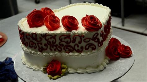 A heart cake for valentine's day is bound to melt your heart. Decorating a Heart Shaped Cake with Red Roses - YouTube