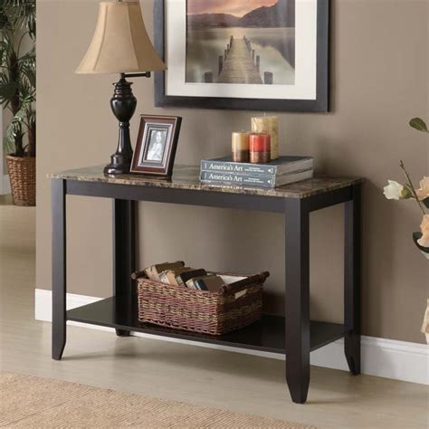 Pair it with metal picture frames, sculptures, or terrariums to add versatility to your console table decor. Monarch Faux Marble Top Console Table in Cappuccino - I 7983S