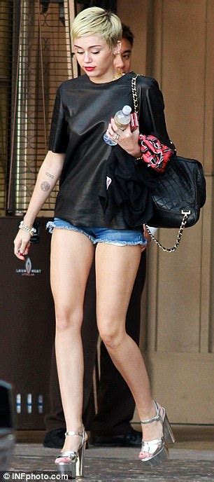 Miley Cyrus Displays Her Never Ending Legs In Tiny Shorts As Snoop