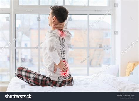 Young Man Suffering Back Pain Bedroom Stock Photo 2033375576 Shutterstock
