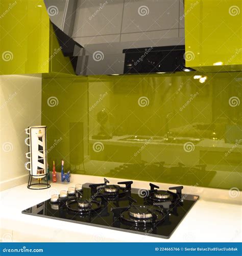 Interior Of Modern Kitchen Equipment And Lacquer Cabinets Stock Photo
