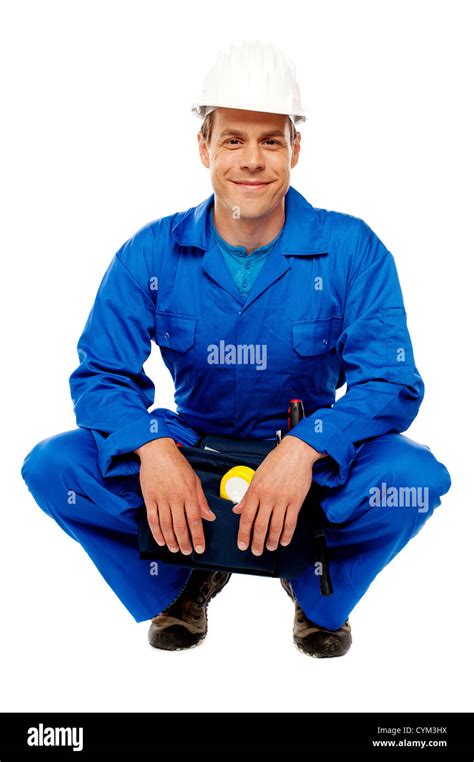 Smiling Male Worker Wearing Safety Hat And Relaxing Break From Work