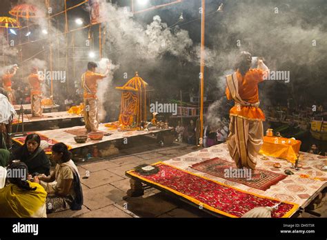 Four Brahmins Swinging Incense Burners During A Puja Ceremony On