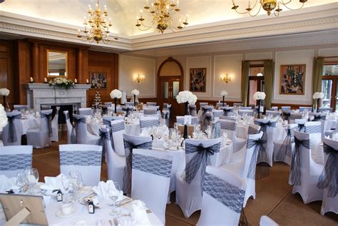 Tying sashes around chairs is a great way to take your décor to the next how far you drape the sash over the chair depends on how much of the backrest you want to cover. black lace chair sashes | Chair sashes, Table decorations ...