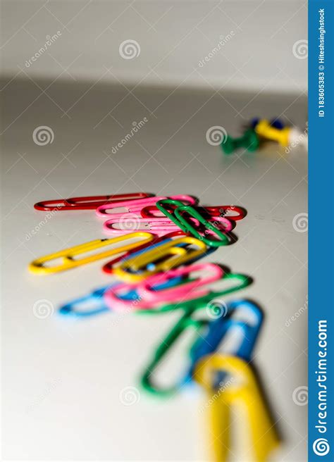 Push Pins And Paper Clips In Different Colors Isolated On