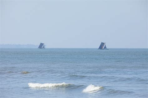 Two Old Traditional Catamarans Boats On The Ocean Stock Photo