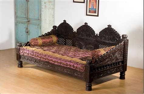 This one is resting on its side. Monsooncraft.com-Indian Carved Maharaja Sofa Set Design. | Carved sofa, Sofa set designs, Indian ...
