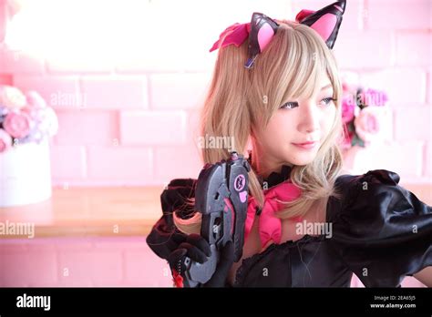 Japan Anime Cosplay Portrait Of Girl Cosplay In Pink Room Background