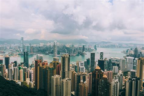 High Angle View Of Cityscape Against Cloudy Sky · Free Stock Photo