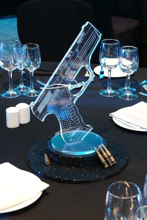 Simple Bond Themed Table Centre With Glitter Plinth Acrylic P99 And Ammunition At The