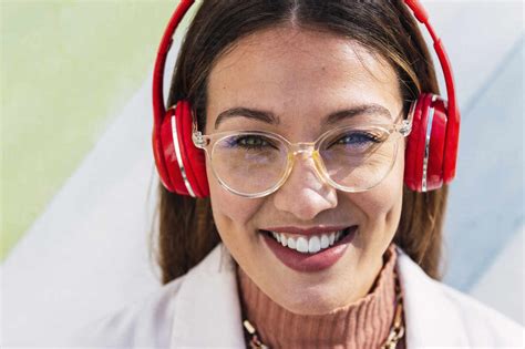 Happy Young Woman Wearing Headphones Stock Photo