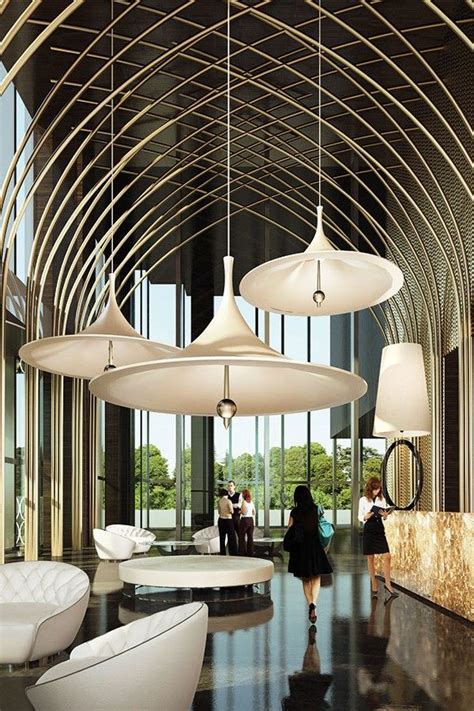 Interior design of classic leather chair and lamp in dim room. 5 Lighting Tips for Your Hotel Lobby - L' Essenziale