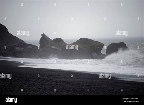 The Reynisdrangar Basalt Sea Stacks And The Reynisfjara Black Sand