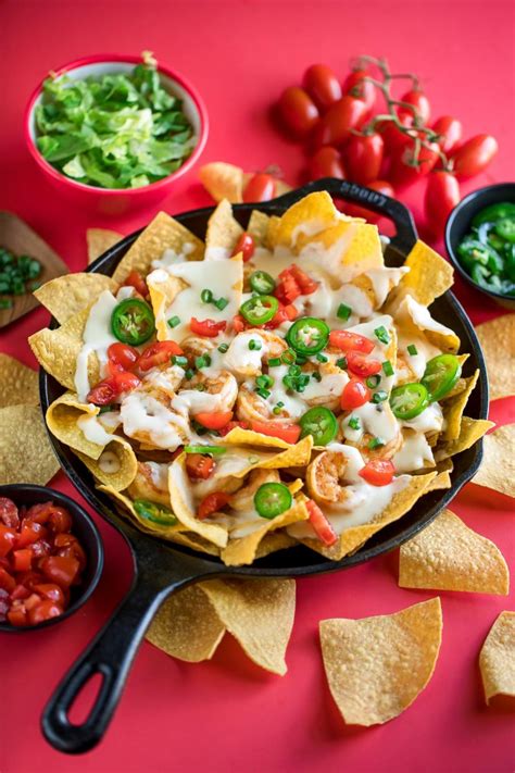 Learn how to make nachos the easy, cheesy, and sometimes spicy way with these awesome nacho recipes. Shrimp Nachos - Peas and Crayons Recipes