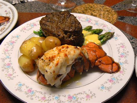 A steak is a meat generally sliced across the muscle fibers, potentially including a bone. steak and lobster dinner menu ideas