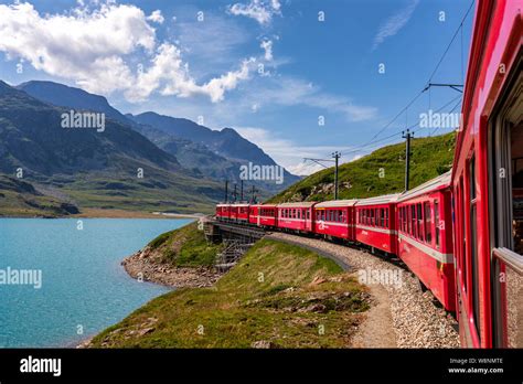 Rhaetian Railway Bernina Express At Lago Bianco Lake Bernina Pass