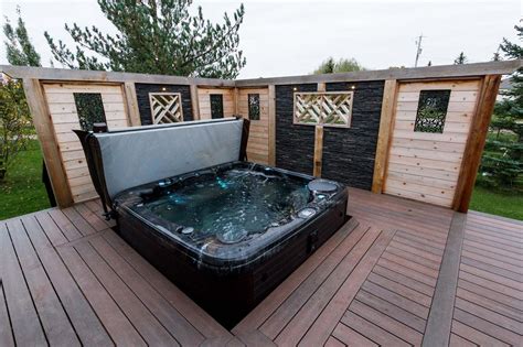 Built In Hot Tub Designs With Low Maintenance Deck And Faux Rock Privacy Walls Hot Tub