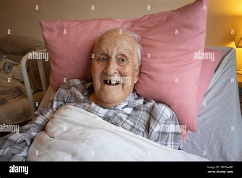 89 Year Old Man Lying In His Bed Whilst Living At A Care Home In England United Kingdom Stock