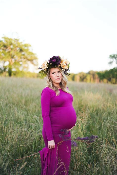 A Pregnant Woman Wearing A Flower Crown In A Field