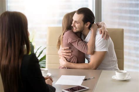 Happy Young Couple Hugging On Meeting With Real Estate Agent Stock Image Image Of House
