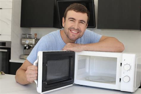 Man Showing A Microwave Oven Stock Image Image Of Domestic Dinner