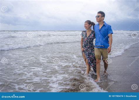 Young Beautiful And Asian Chinese Romantic Couple Walking Together