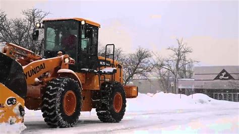 A Big Plow Clears Snow From Parking Lot Youtube