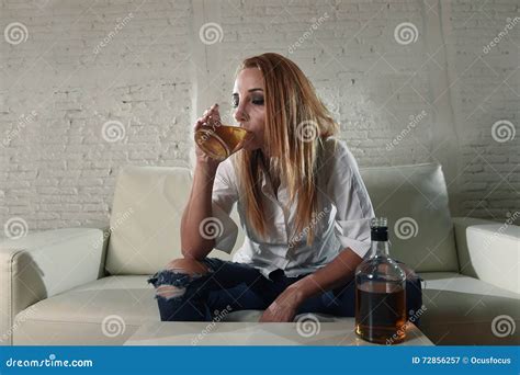 Sad Depressed Alcoholic Drunk Woman Drinking At Home In Housewife