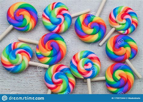 Lollipops On White Wooden Background Colorful Candies Stock Photo