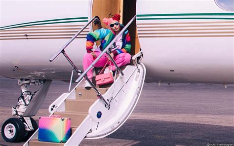 Nicki Minaj Flaunts Enviable Curves In Island Themed Red Ruby Da