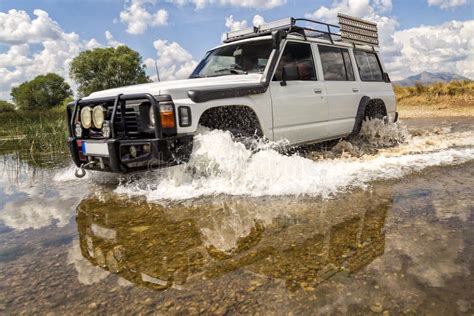 Off Road Vehicle Crossing River Editorial Image Image Of Automobile
